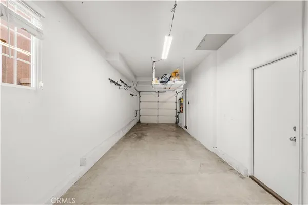 a view of a storage and utility room with washer and dryer