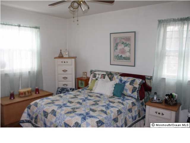 1137 Leonard Road Point Pleasant, NJ 08742 - Photo 11 of 25 a bedroom with a bed and a window