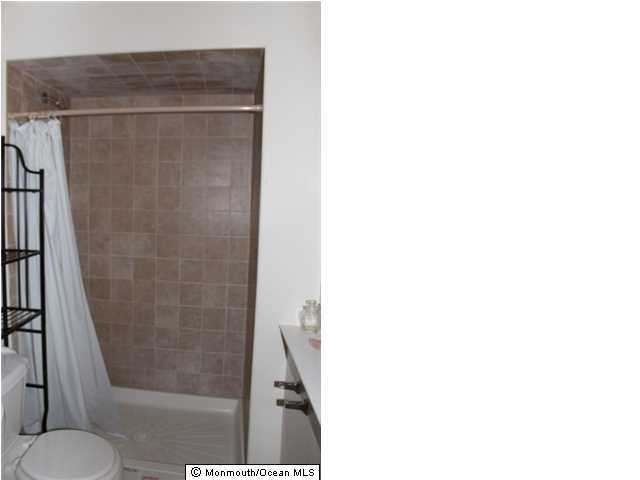 1137 Leonard Road Point Pleasant, NJ 08742 - Photo 16 of 25 a bathroom with a shower and a toilet