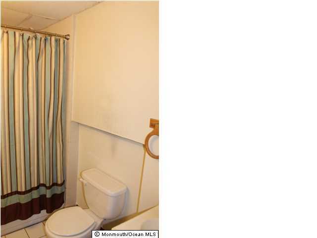 1137 Leonard Road Point Pleasant, NJ 08742 - Photo 17 of 25 a bathroom with a toilet and a shower
