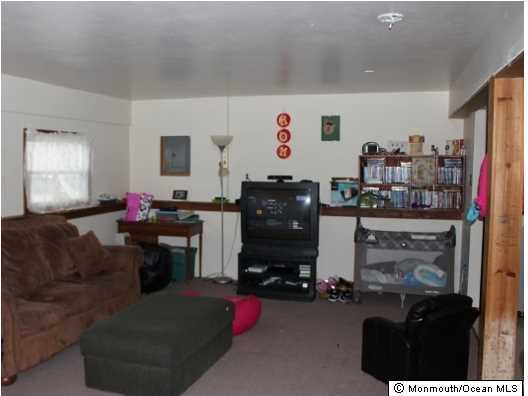 1137 Leonard Road Point Pleasant, NJ 08742 - Photo 18 of 25 a room with furniture and a flat screen tv