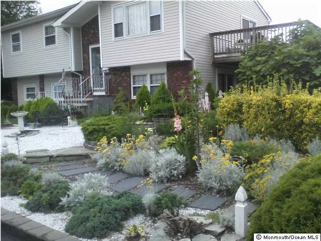 1137 Leonard Road Point Pleasant, NJ 08742 - Photo 2 of 25 a view of a house with a yard and plants