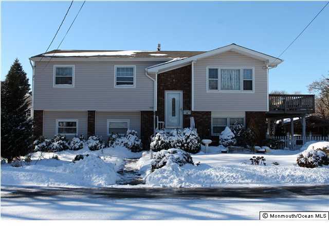 1137 Leonard Road Point Pleasant, NJ 08742 - Photo 25 of 25 a front view of a house with garage