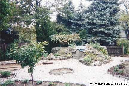 1137 Leonard Road Point Pleasant, NJ 08742 - Photo 3 of 25 a view of a backyard of the house