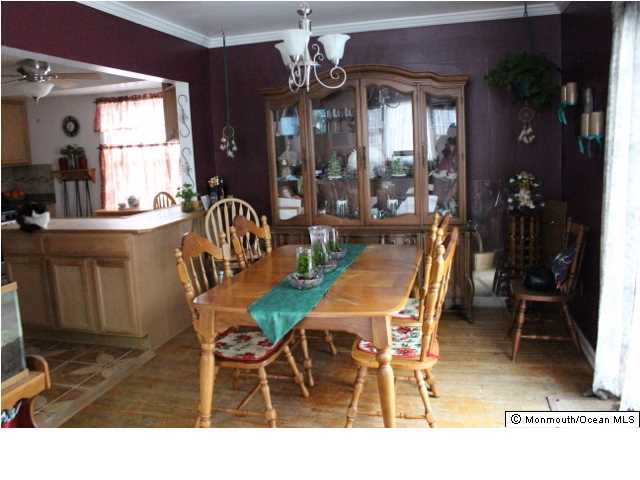 1137 Leonard Road Point Pleasant, NJ 08742 - Photo 6 of 25 a dining room filled with furniture and window