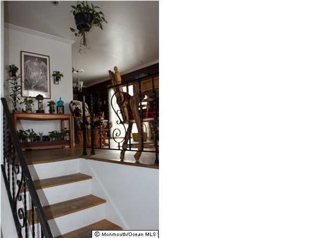 1137 Leonard Road Point Pleasant, NJ 08742 - Photo 7 of 25 a view of a living room with clothes and shoes