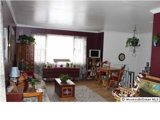 1137 Leonard Road Point Pleasant, NJ 08742 - Photo 9 of 25 a living room with furniture a rug and a large window
