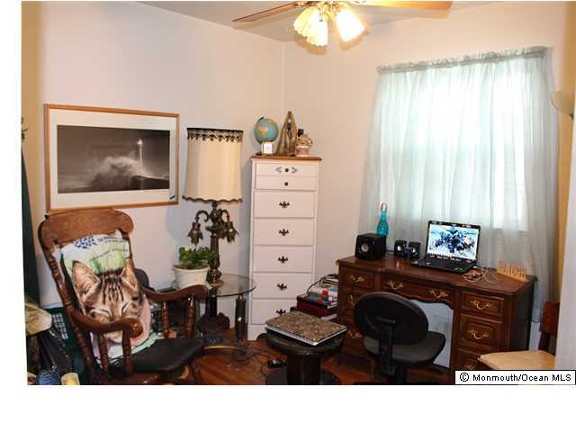 1137 Leonard Road Point Pleasant, NJ 08742 - Photo 10 of 25 a living room with furniture and a window