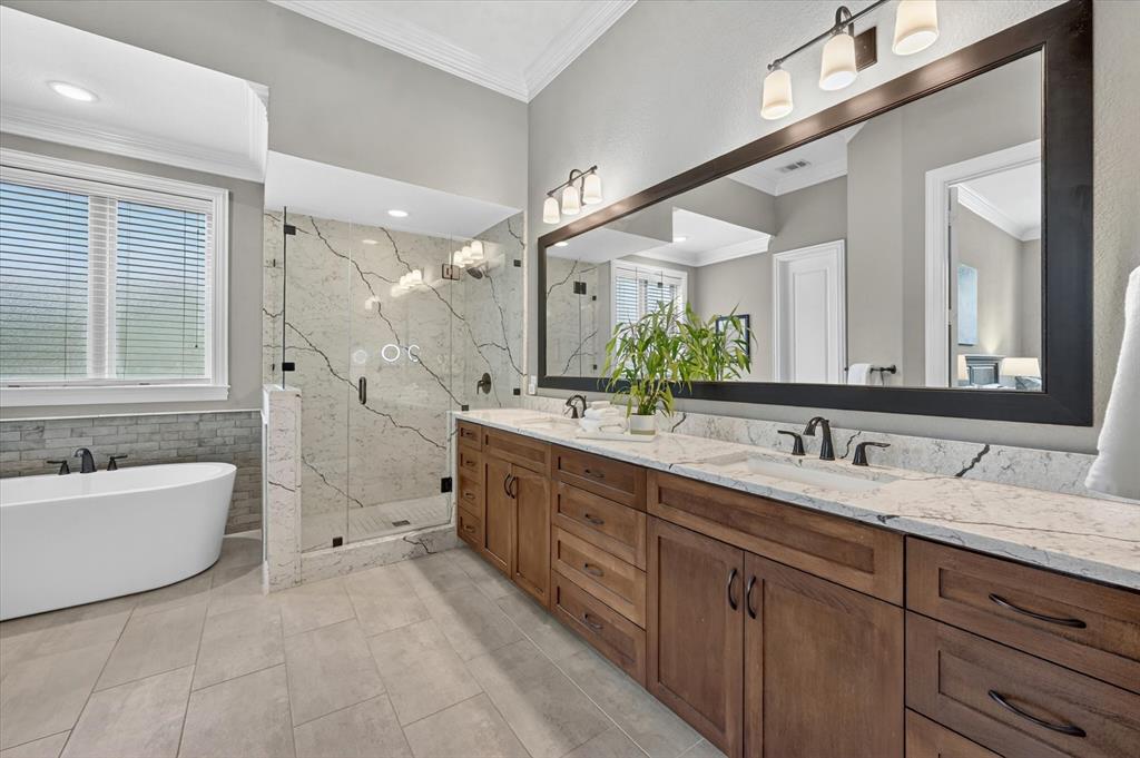 6656 Roughleaf Ridge Road Flower Mound, TX 76226 - Photo 19 of 40 a spacious bathroom with a double vanity sink mirror double and bathtub