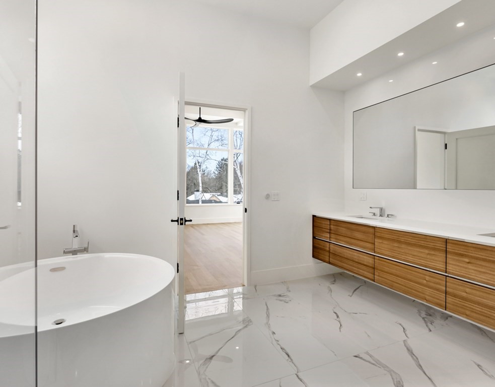 28 Eliot Road Lexington, MA 02421 - Photo 16 of 23 a bathroom with a bathtub and a sink