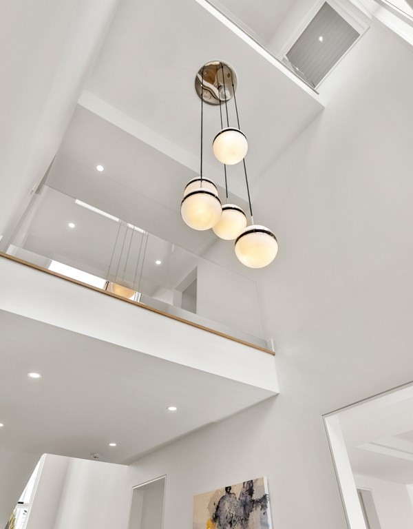 28 Eliot Road Lexington, MA 02421 - Photo 3 of 23 a bathroom with a light fixture and a sink