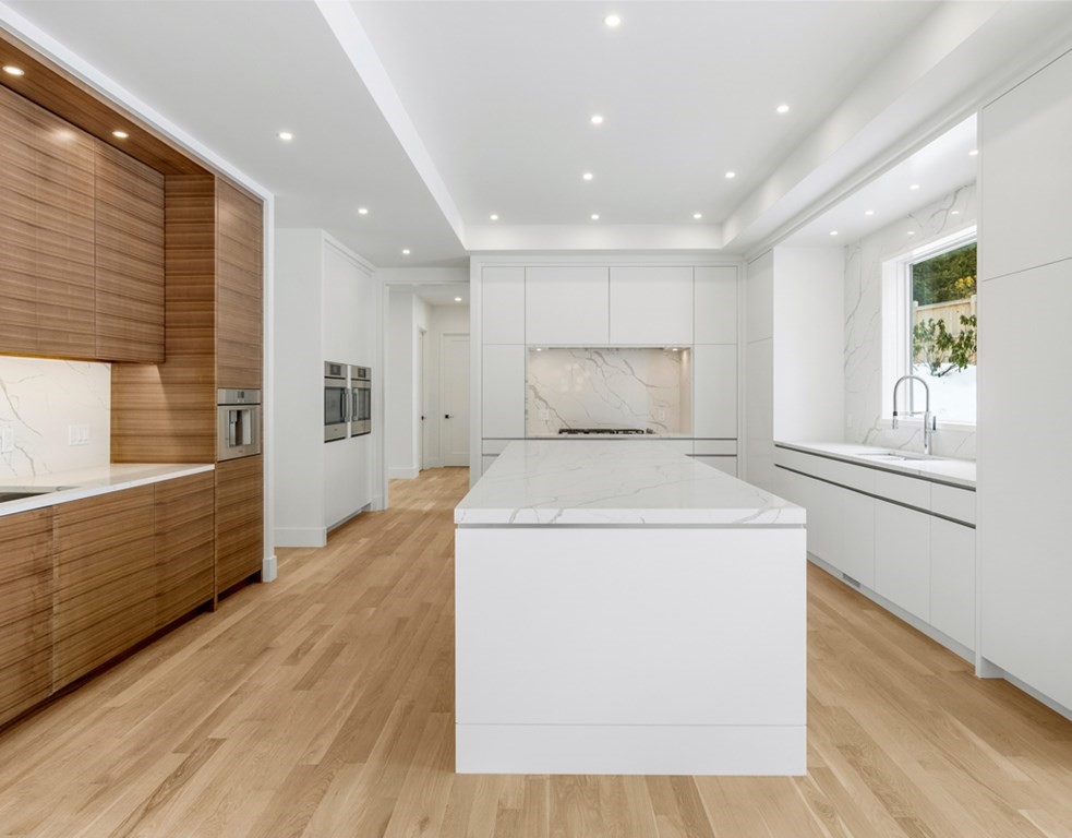 28 Eliot Road Lexington, MA 02421 - Photo 9 of 23 a view of washer and dryer with wooden floor