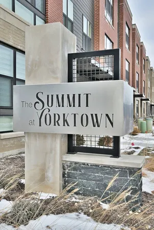 a street sign on a brick wall