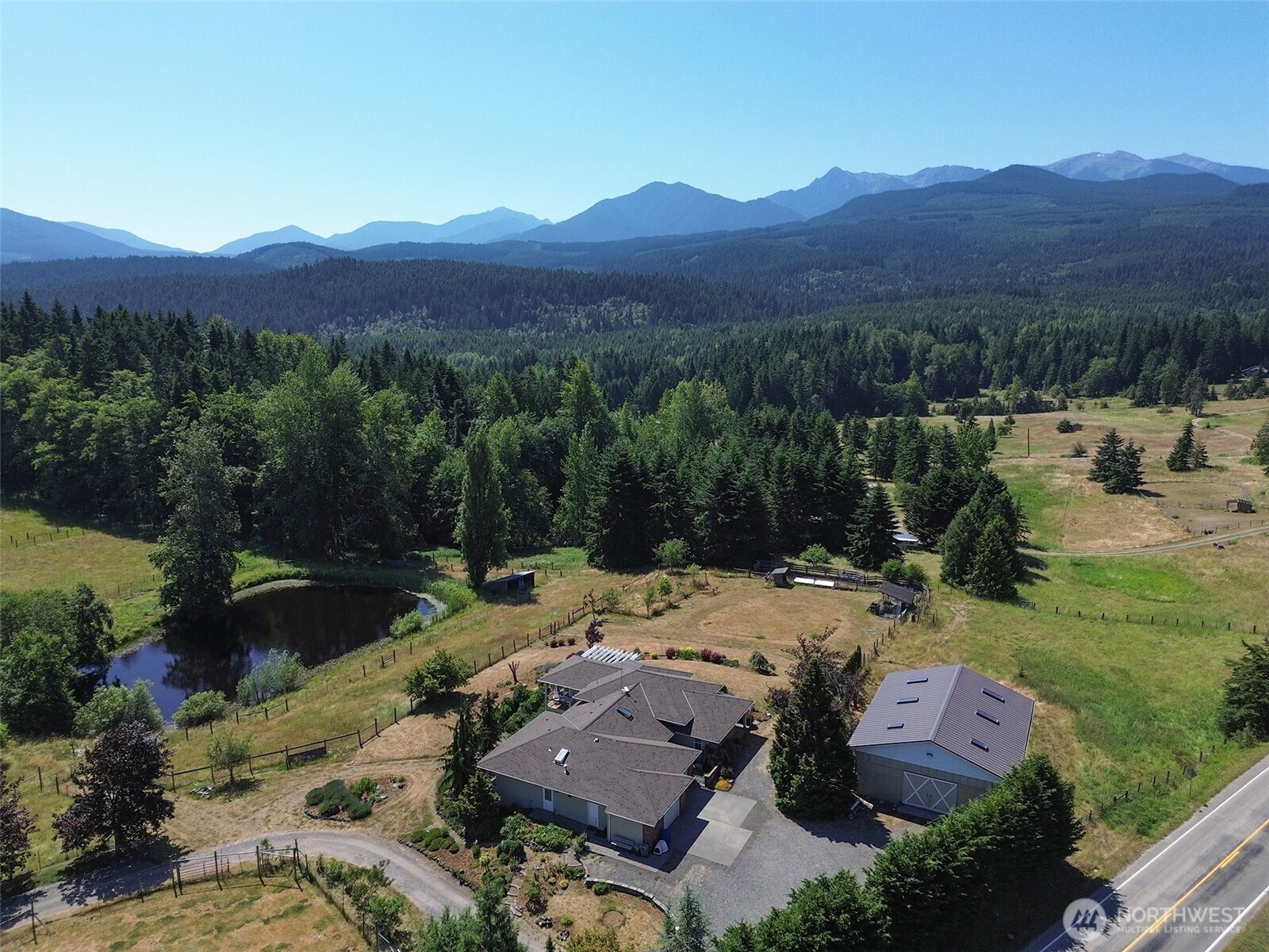 a view of a house with a mountain yard