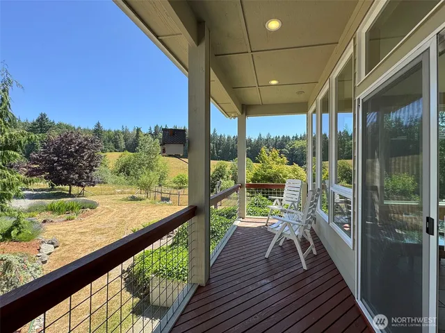 a view of a balcony with wooden floor