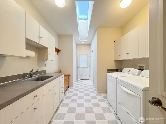 a kitchen with a sink and cabinets