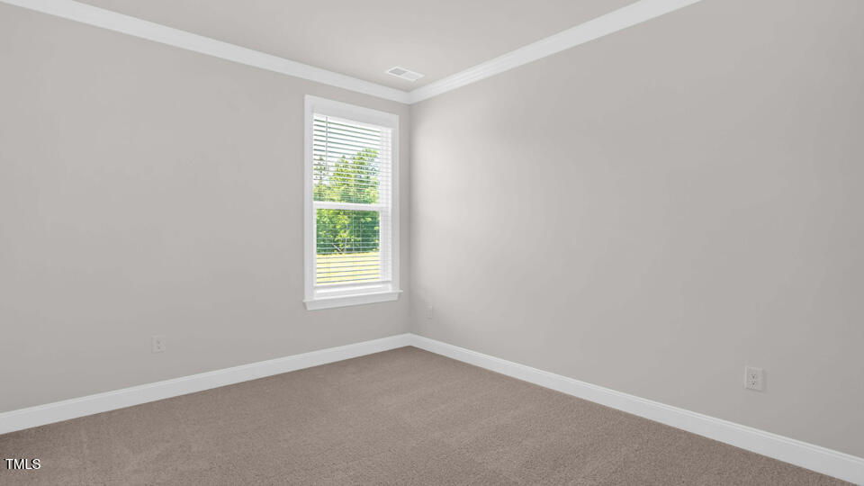 176 Red Jasper Way Clayton, NC 27520 - Photo 11 of 35 an empty room with a window