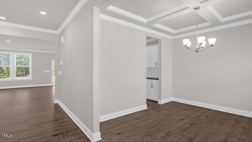 176 Red Jasper Way Clayton, NC 27520 - Photo 2 of 35 a view of an empty room with wooden floor and a window