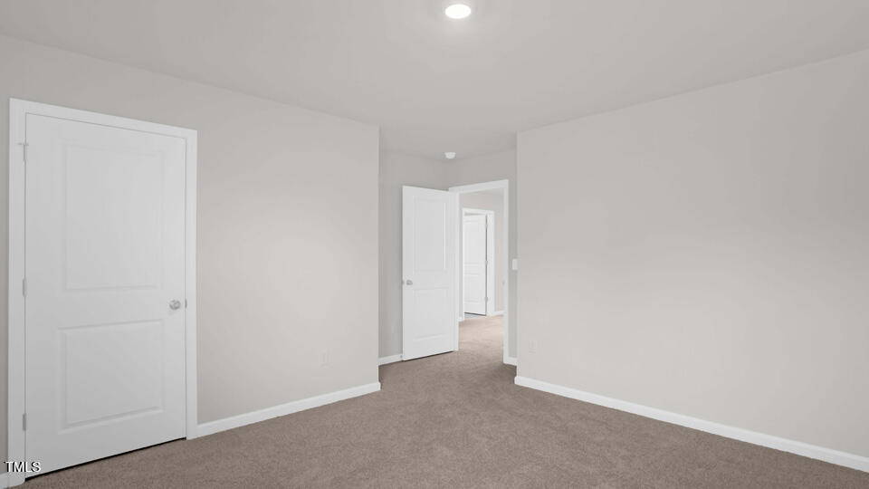 176 Red Jasper Way Clayton, NC 27520 - Photo 23 of 35 a view of an empty room
