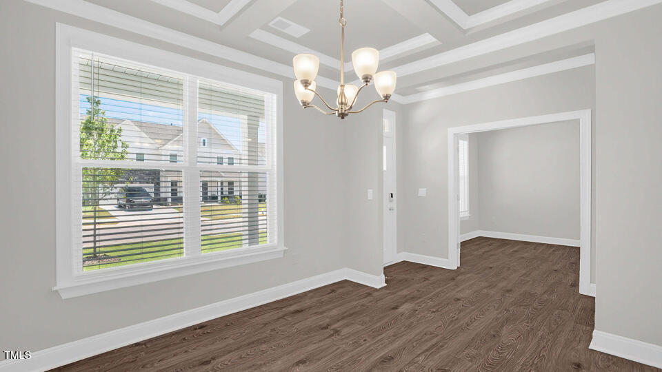 176 Red Jasper Way Clayton, NC 27520 - Photo 3 of 35 a view of an empty room with wooden floor and a window