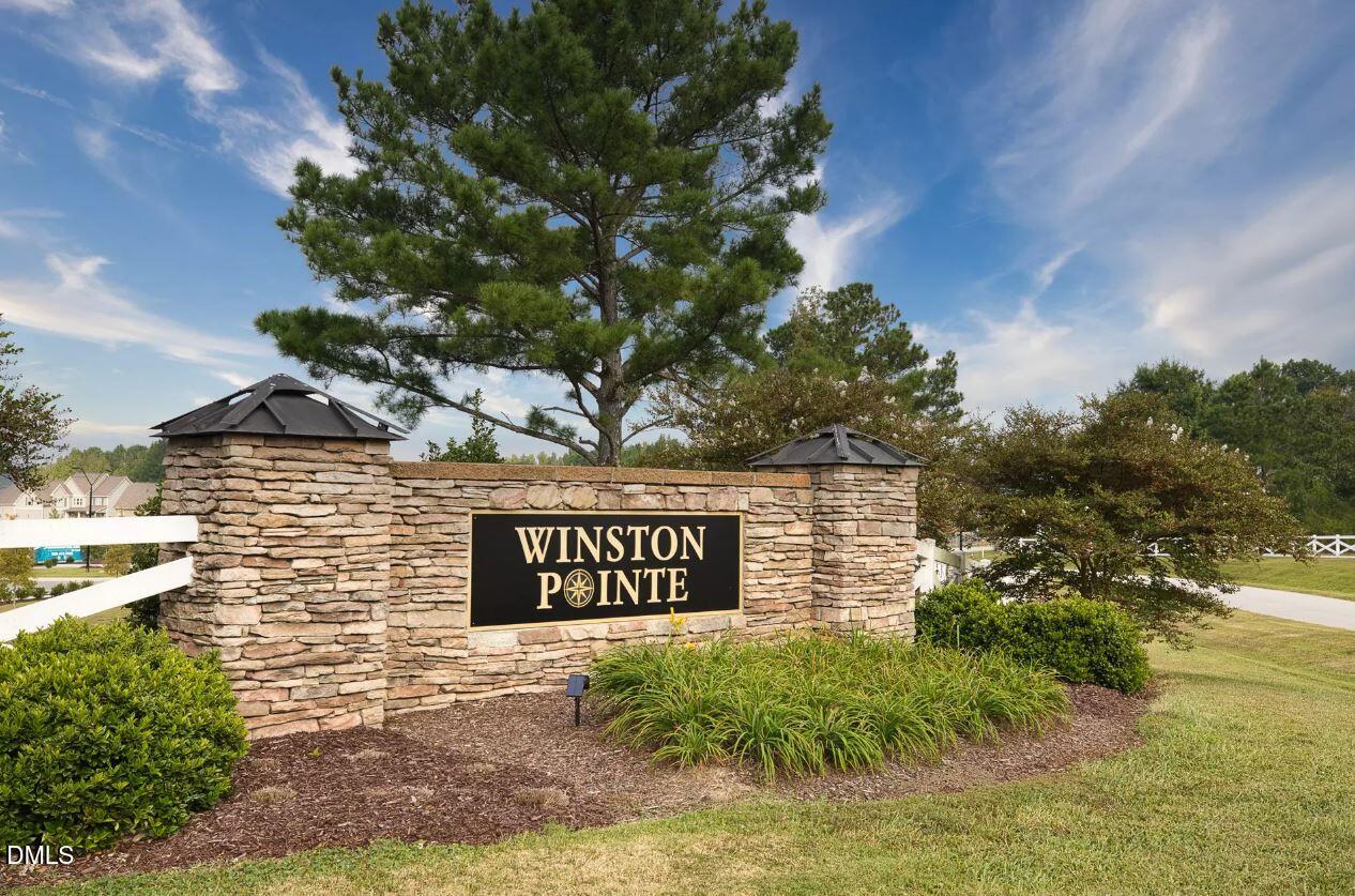 176 Red Jasper Way Clayton, NC 27520 - Photo 35 of 35 a sign that is sitting on a brick wall