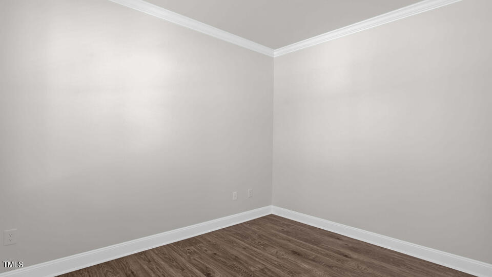 176 Red Jasper Way Clayton, NC 27520 - Photo 4 of 35 a view of an empty room with wooden floor