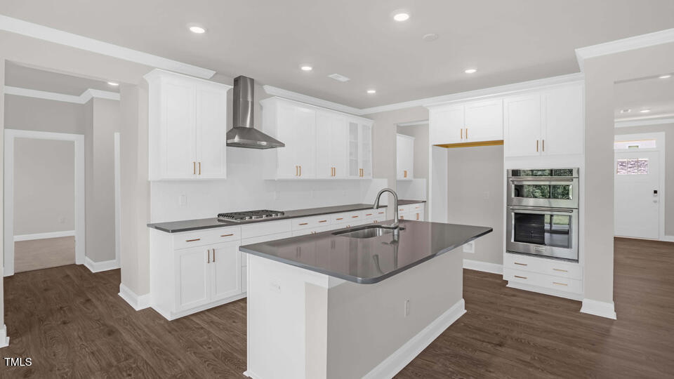 176 Red Jasper Way Clayton, NC 27520 - Photo 9 of 35 a kitchen with stainless steel appliances granite countertop a sink stove and refrigerator