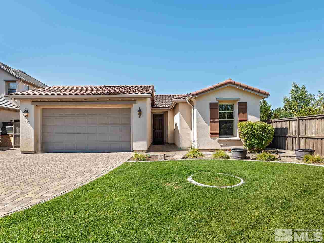 404 Sysonby Court Reno, NV 89521 - Photo 1 of 25 a view of a house with a yard and sitting area