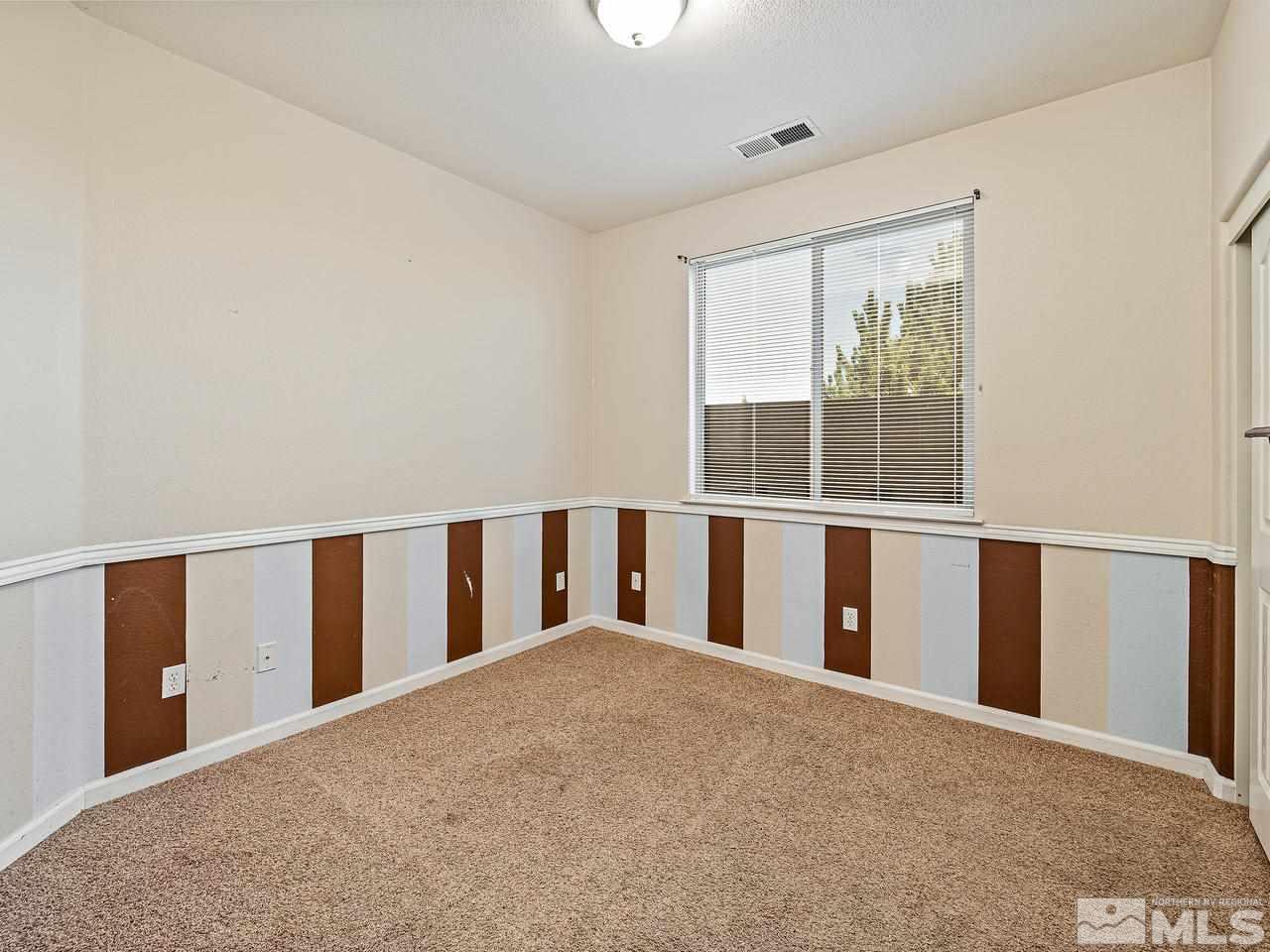 404 Sysonby Court Reno, NV 89521 - Photo 15 of 25 a view of an empty room with a window