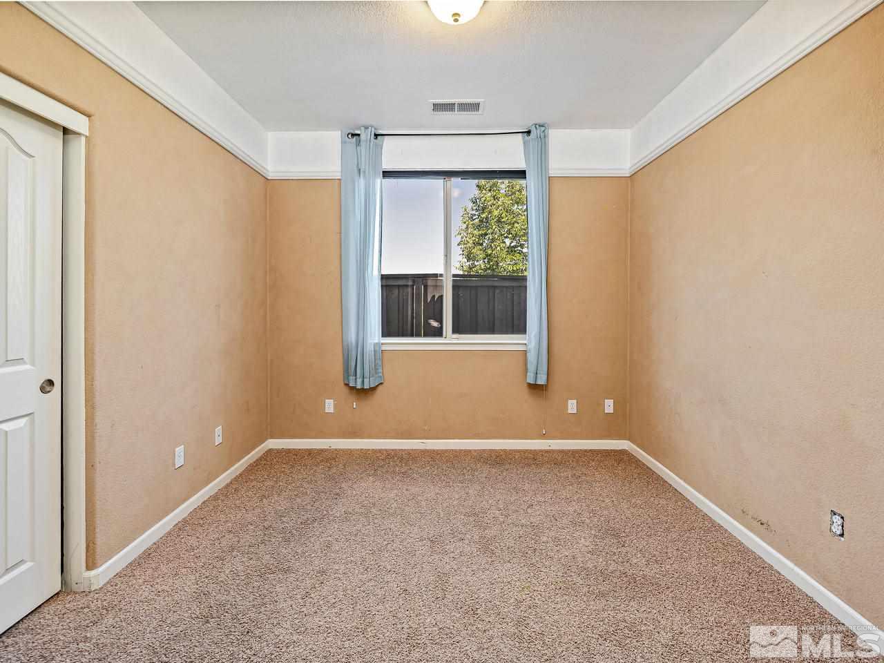 404 Sysonby Court Reno, NV 89521 - Photo 16 of 25 an empty room with a window