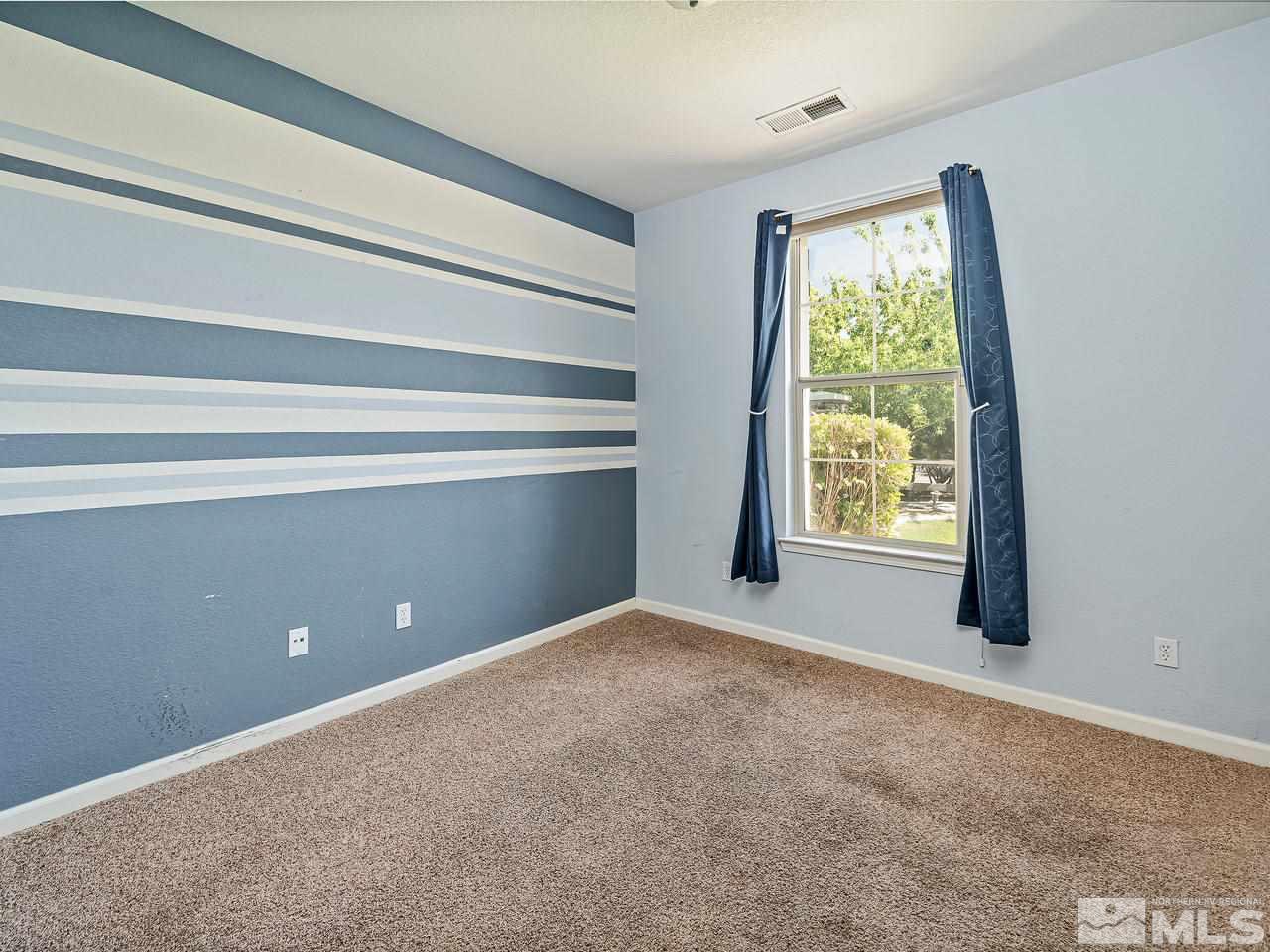 404 Sysonby Court Reno, NV 89521 - Photo 17 of 25 a view of an empty room with a window