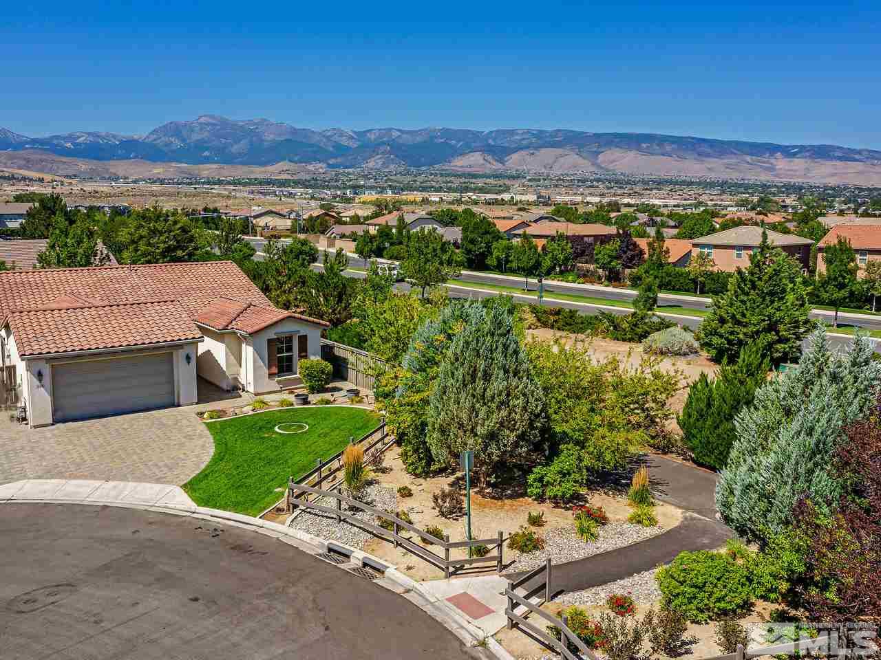 404 Sysonby Court Reno, NV 89521 - Photo 3 of 25 an aerial view of a house with a garden and lake view