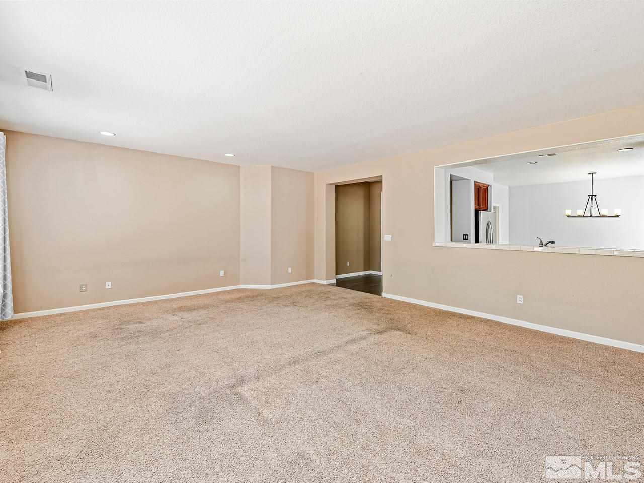 404 Sysonby Court Reno, NV 89521 - Photo 9 of 25 a view of an empty room with a window