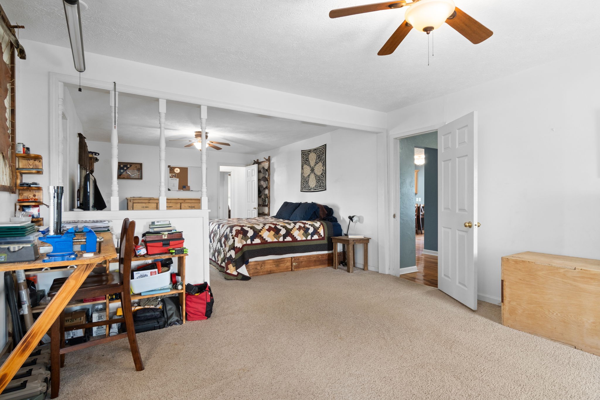 5150 Cadiz Road Hopkinsville, KY 42240 - Photo 24 of 45 a bedroom with furniture and a chandelier