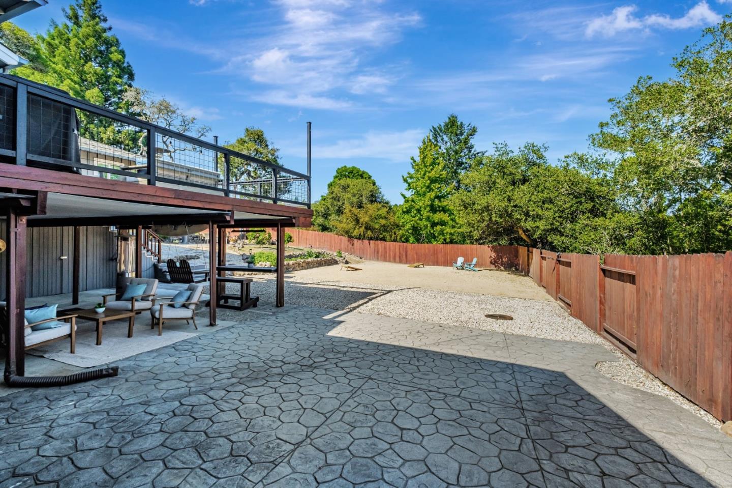 770 Graham Hill Road Santa Cruz, CA 95060 - Photo 71 of 83 a view of a patio with table and chairs with wooden fence and plants