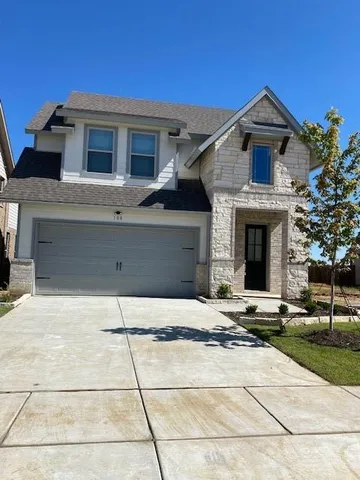 a front view of a house with yard
