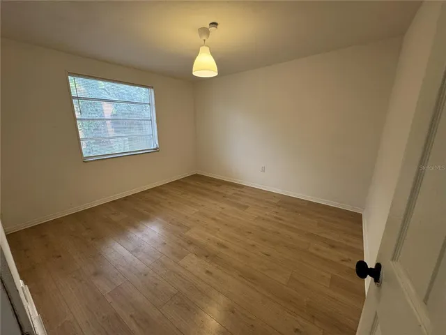 a view of an empty room and window