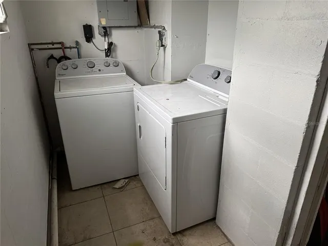 a utility room with dryer and washer