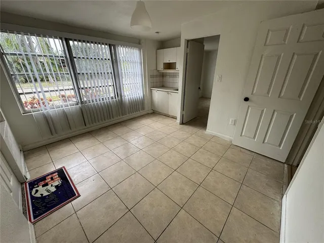 a view of an empty room and a sink