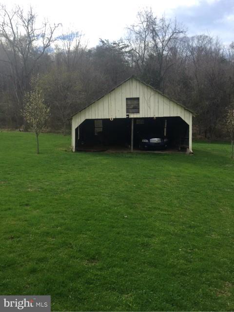 7744 Talbot Run Road Mount Airy, MD 21771 - Photo 29 of 30 a house in middle of the green field