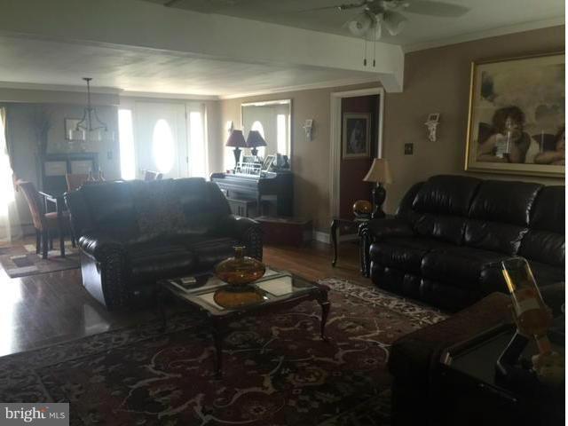7744 Talbot Run Road Mount Airy, MD 21771 - Photo 4 of 30 a living room with furniture and wooden floor