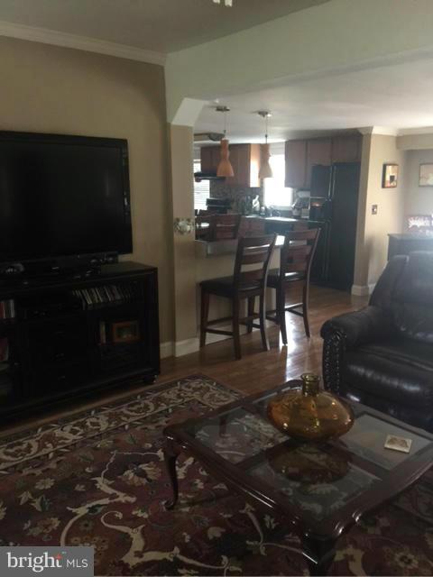 7744 Talbot Run Road Mount Airy, MD 21771 - Photo 5 of 30 a living room with furniture and a flat screen tv