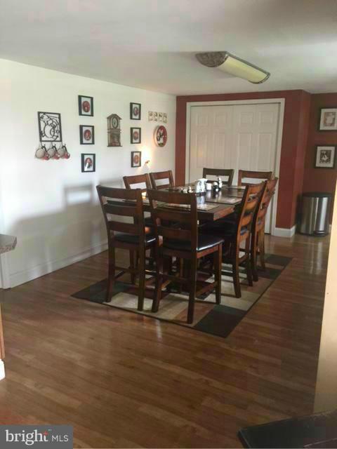 7744 Talbot Run Road Mount Airy, MD 21771 - Photo 8 of 30 a view of a dining room with furniture and wooden floor