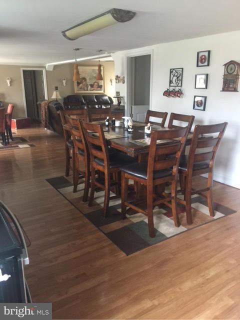 7744 Talbot Run Road Mount Airy, MD 21771 - Photo 9 of 30 a view of a dining room with furniture and wooden floor