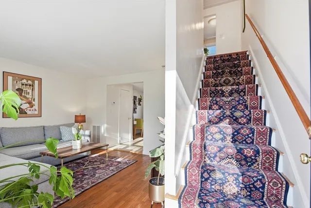 a living room with furniture and a rug