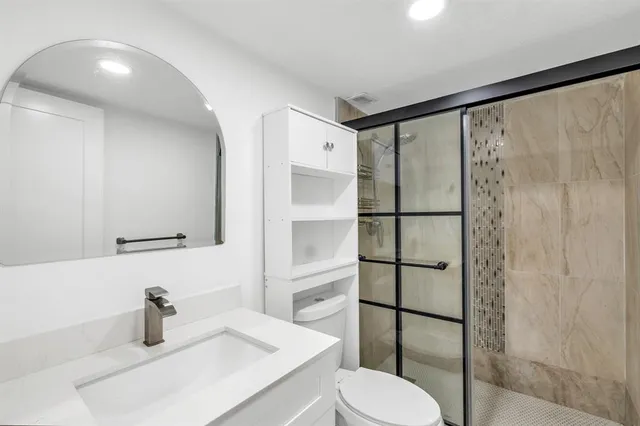 a bedroom with a bed and dresser