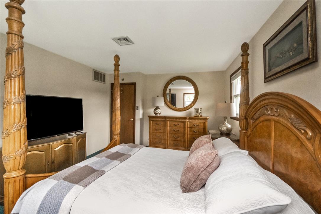 5728 Pheasant Road Bethlehem, PA 18017 - Photo 25 of 39 Smooth plaster walls and neat wood trim frame this comfortable bedroom retreat.