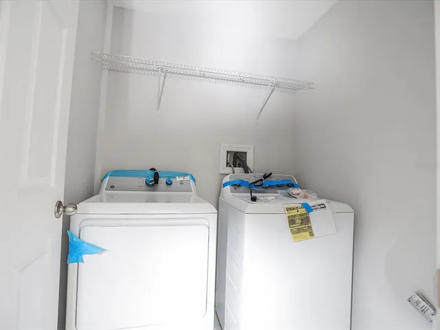 a utility room with dryer and washer