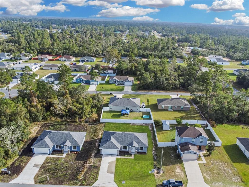 16619 Southwest 31st Circle Ocala, FL 34473 - Photo 23 of 26 a view of a city with lawn chairs