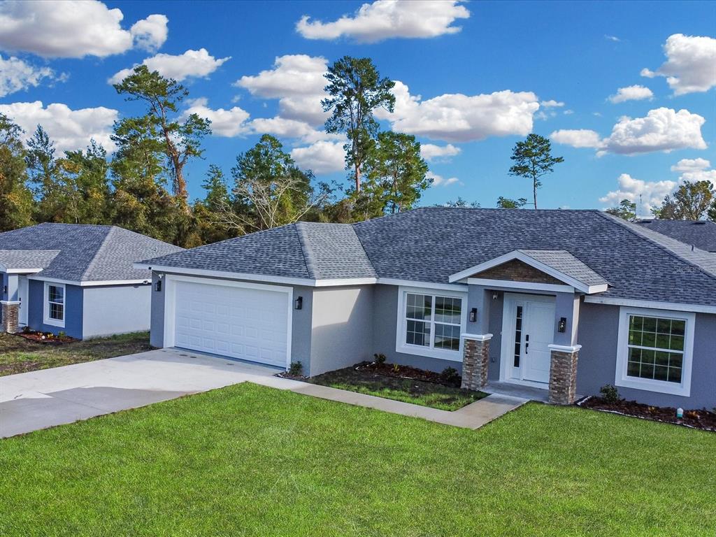 16619 Southwest 31st Circle Ocala, FL 34473 - Photo 4 of 26 a view of a yard in front of house